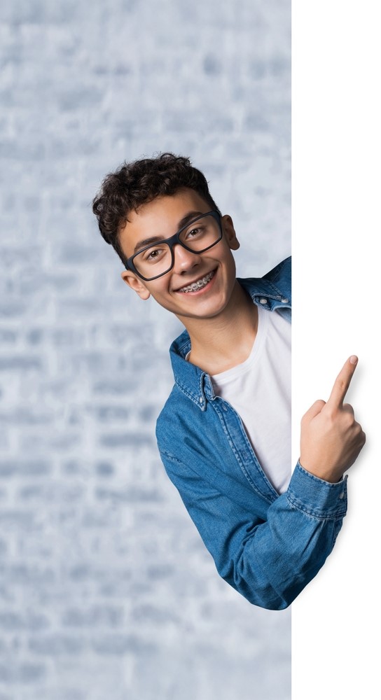 teen boy with braces, pointing to the right